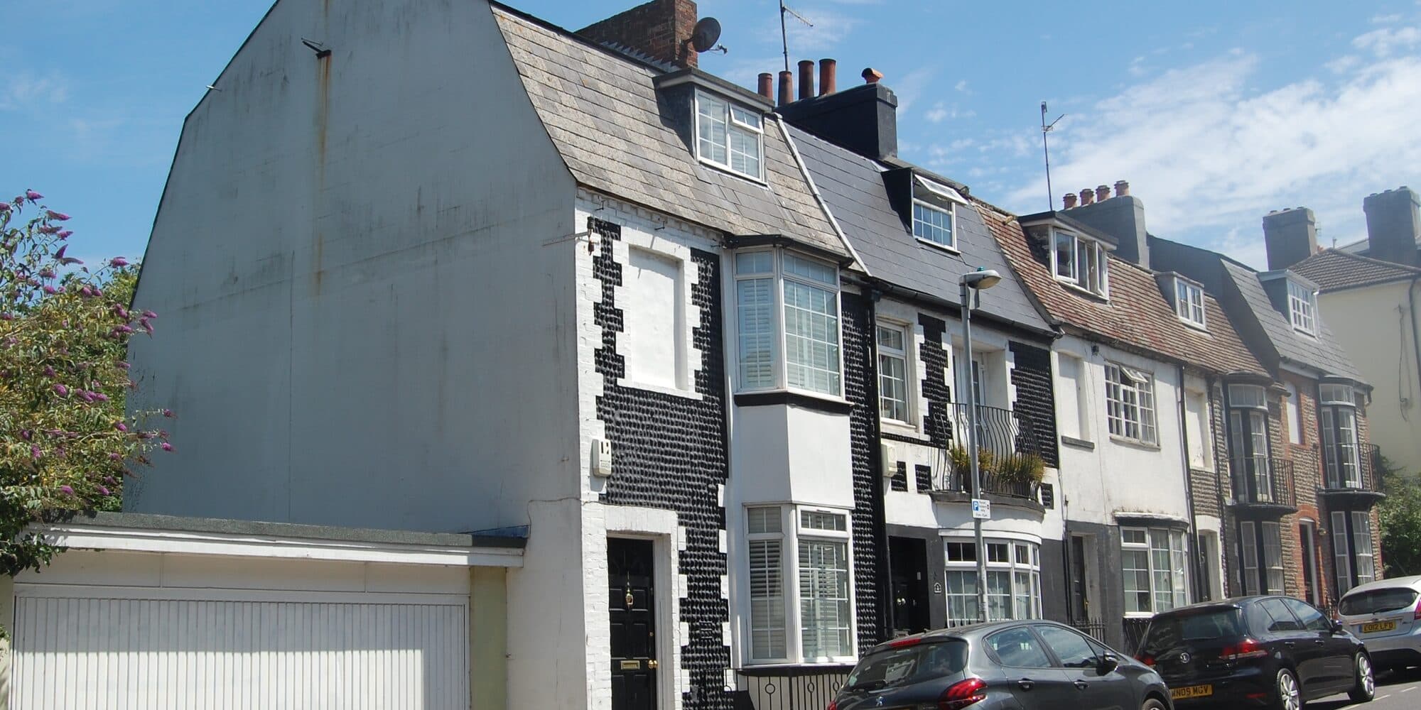 Black-tiled terraced houses climbing Southover Street in Hanover, Brighton