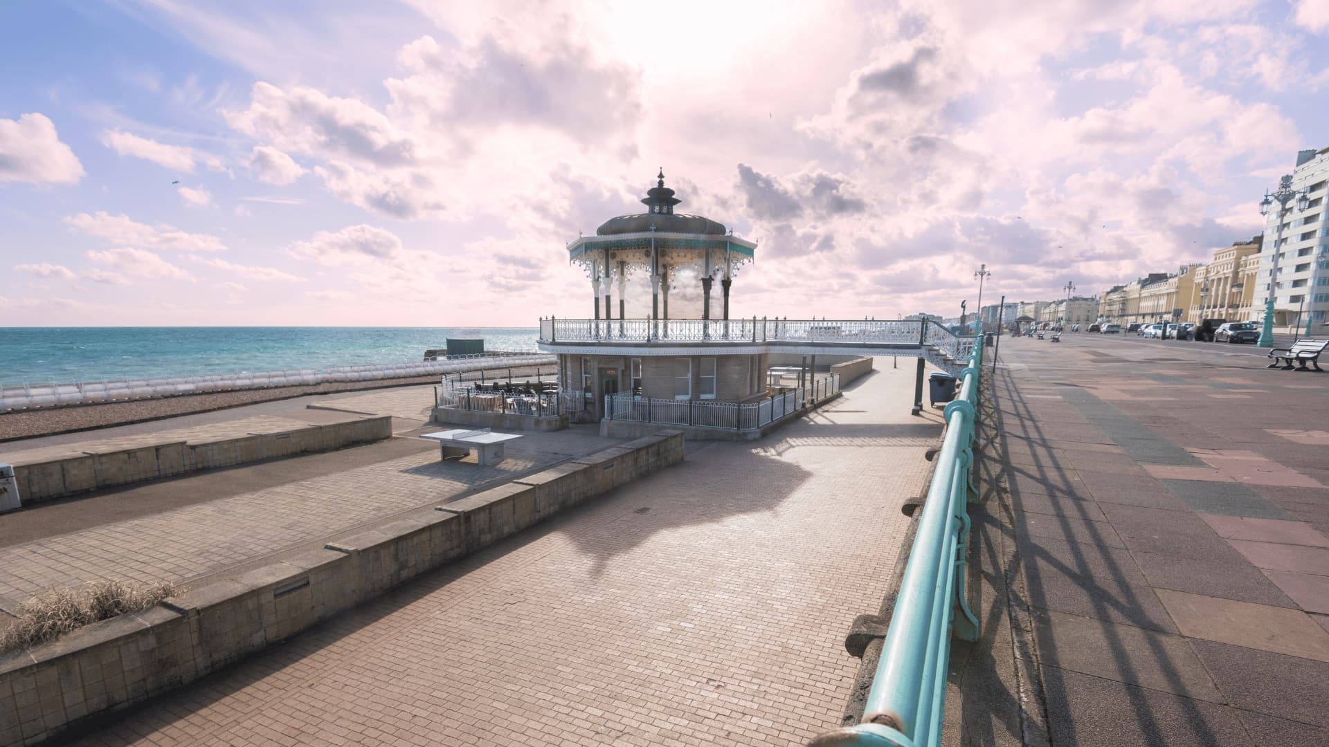 Brighton's ornate seafront bandstand beneath a wide coastal sky