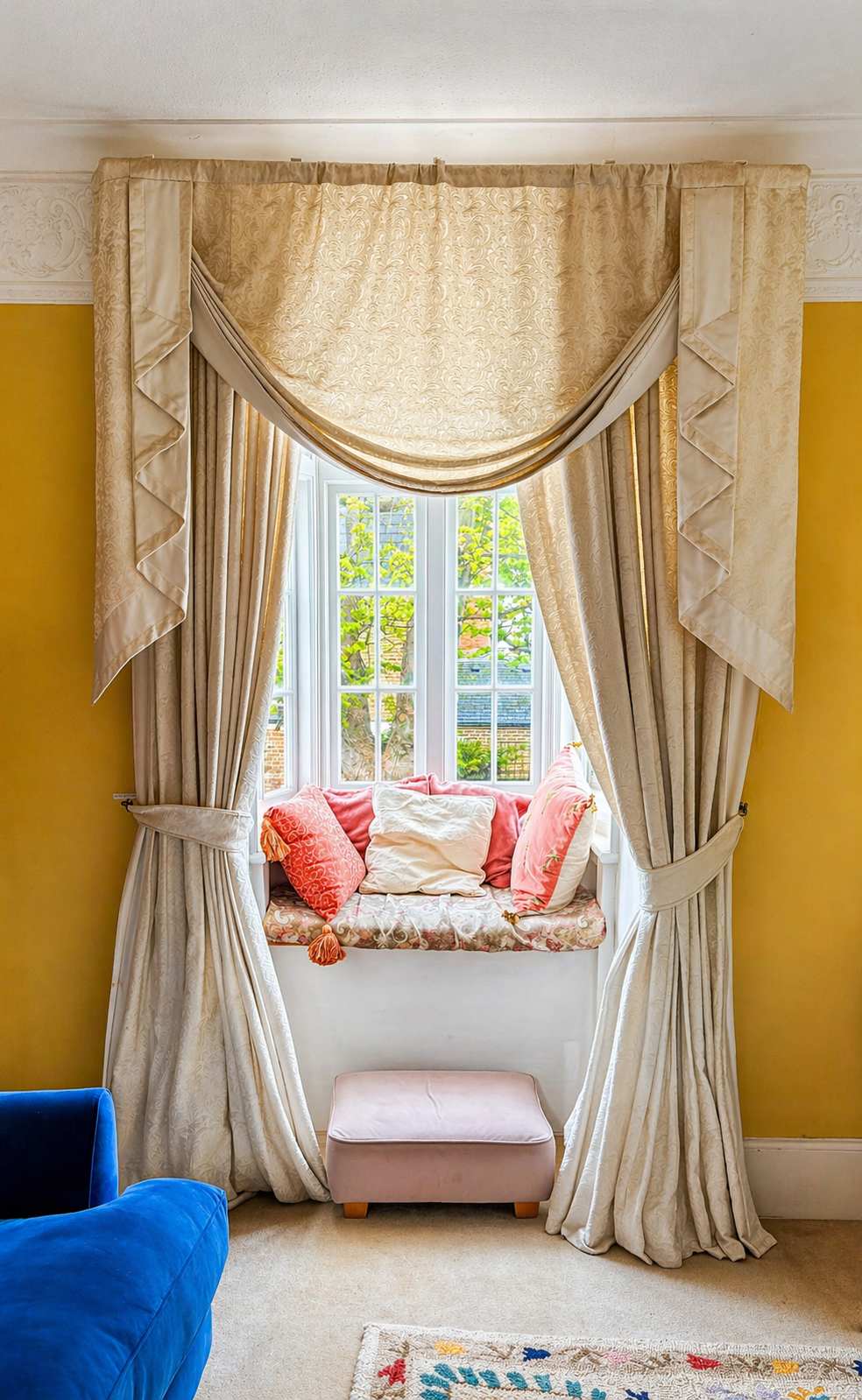 Sunlit window seat in the yellow sitting room of the South House Worthing townhouse